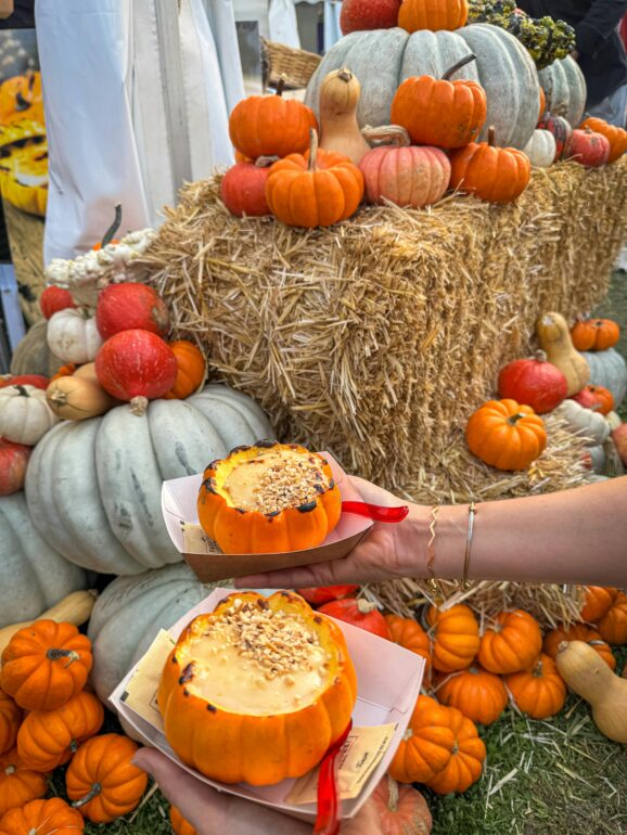 Vibrant pumpkins and desserts showcased at a market in Bursa, Türkiye.